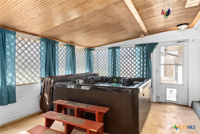 kitchen with wooden ceiling, concrete floors, and vaulted ceiling