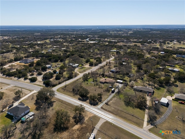 birds eye view of property with a rural view