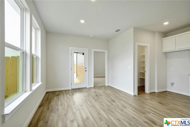 spare room with light wood-type flooring