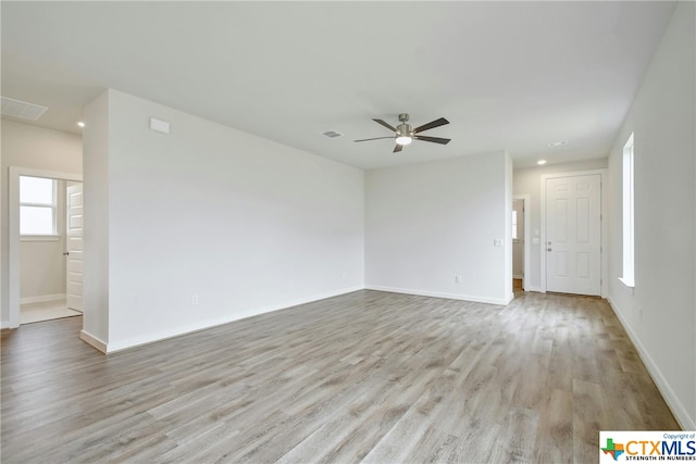 unfurnished room featuring light hardwood / wood-style floors and ceiling fan