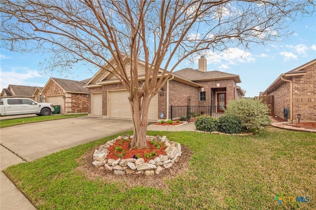 view of front of house with a garage and a front lawn