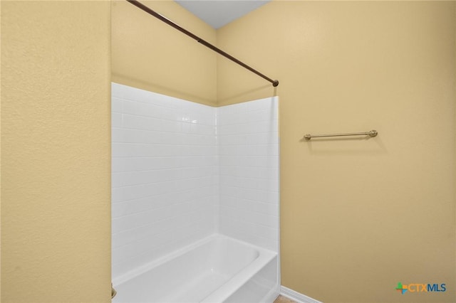 bathroom with shower / bath combination