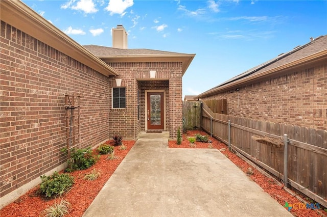 entrance to property with a patio