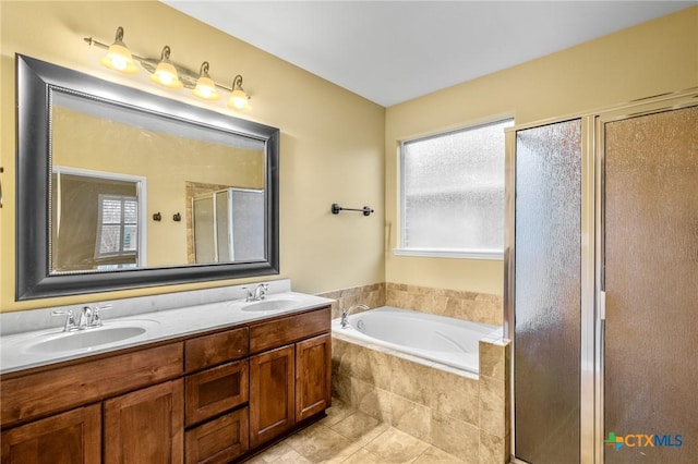 bathroom with vanity, tile patterned floors, and plus walk in shower