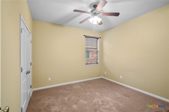 unfurnished bedroom with ceiling fan and carpet