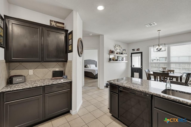 471 Copper Hill Dr, New Braunfels, TX 78130 - kitchen with dishwasher, a chandelier, tasteful backsplash, light tile patterned floors, and dark brown cabinets