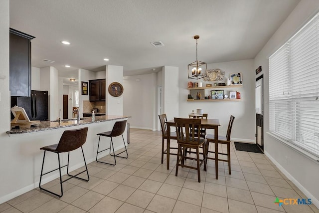 471 Copper Hill Dr, New Braunfels, TX 78130 - dining room with a chandelier, recessed lighting, and light tile patterned floors