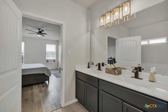 471 Copper Hill Dr, New Braunfels, TX 78130 - bathroom featuring ensuite bathroom, double vanity, a ceiling fan, and wood finished floors