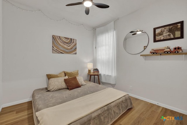 471 Copper Hill Dr, New Braunfels, TX 78130 - bedroom featuring wood finished floors and a ceiling fan
