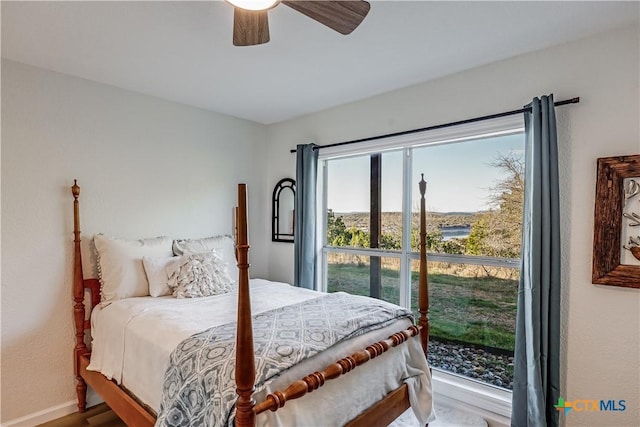 bedroom featuring a ceiling fan and baseboards