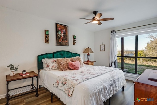 bedroom featuring ceiling fan and wood finished floors