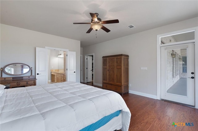 bedroom featuring dark wood-style floors, baseboards, ensuite bath, and a ceiling fan