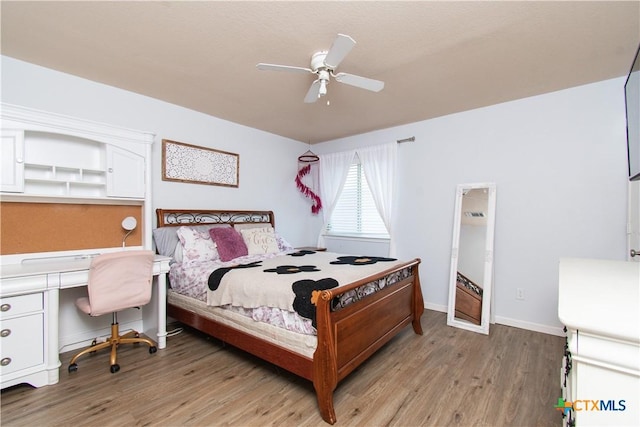 5516 Birmingham Cir, Killeen, TX 76542 - bedroom with light wood-style floors, a desk, and a ceiling fan