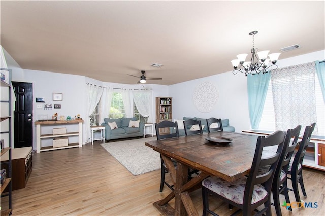 5516 Birmingham Cir, Killeen, TX 76542 - dining room featuring light wood-style flooring, a chandelier, and a ceiling fan