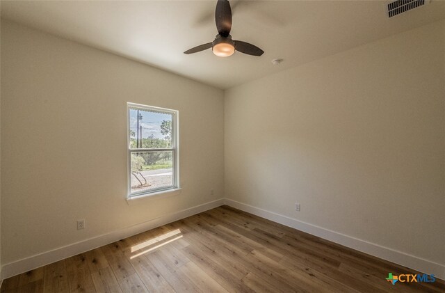 unfurnished room featuring ceiling fan and light hardwood / wood-style flooring