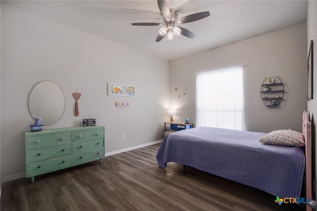 bedroom with dark hardwood / wood-style floors and ceiling fan