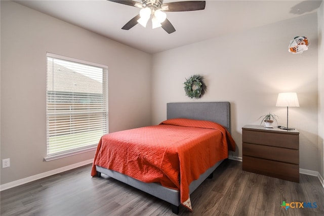 bedroom featuring ceiling fan and dark hardwood / wood-style floors