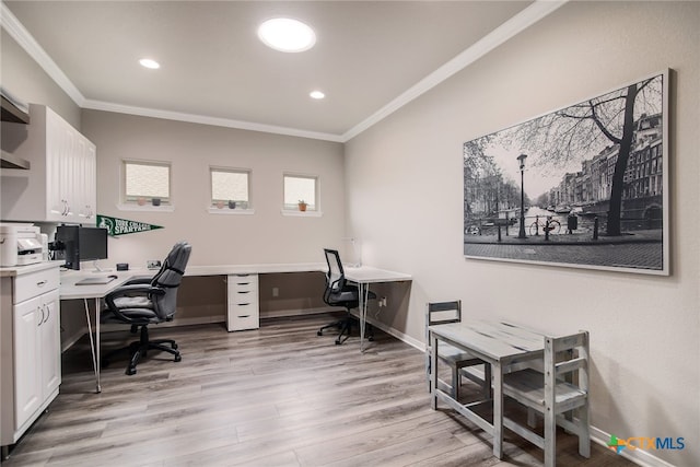 office area with light hardwood / wood-style flooring and ornamental molding