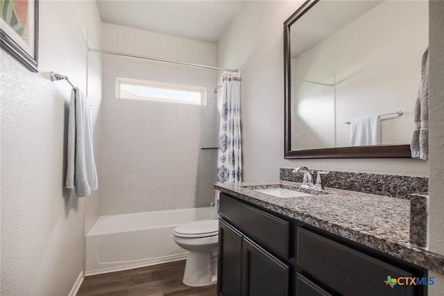 full bathroom featuring hardwood / wood-style flooring, vanity, toilet, and shower / bath combo