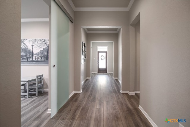 corridor featuring dark hardwood / wood-style floors and ornamental molding