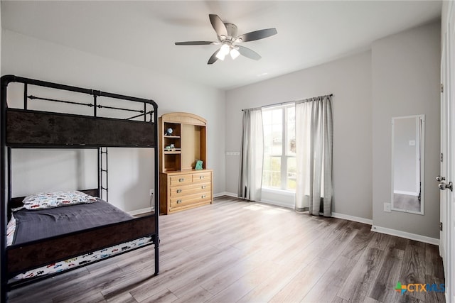 bedroom featuring hardwood / wood-style floors and ceiling fan