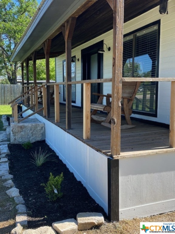 wooden deck featuring covered porch