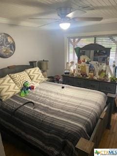319 W Village Rd, Salado, TX 76571 - bedroom with wood finished floors, ornamental molding, and ceiling fan