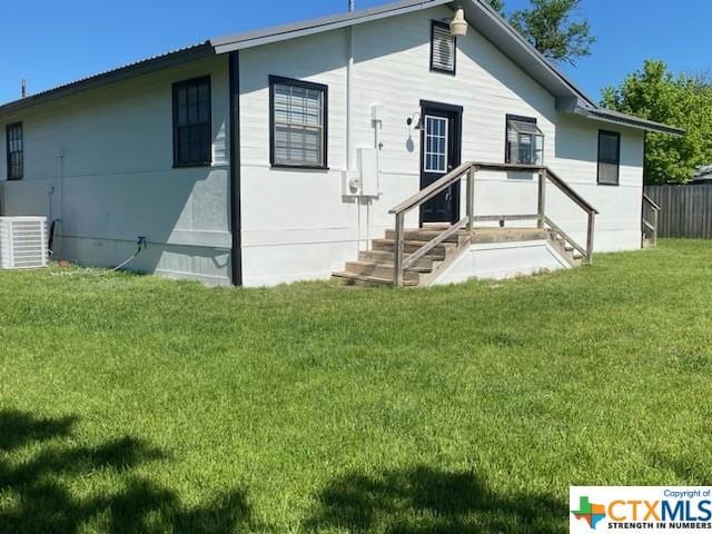 319 W Village Rd, Salado, TX 76571 - rear view of property with central AC unit