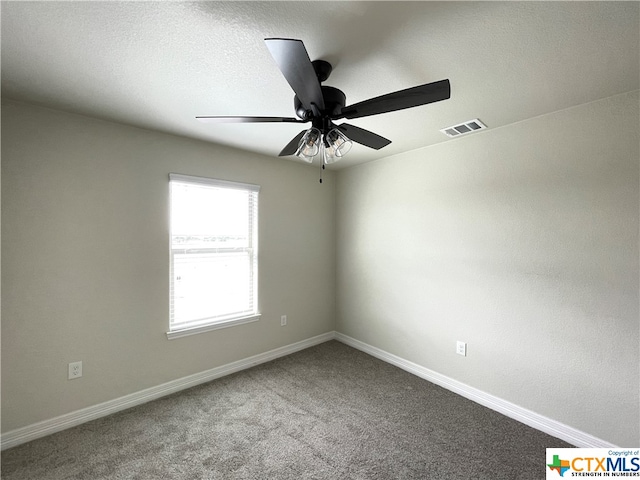 carpeted empty room with ceiling fan