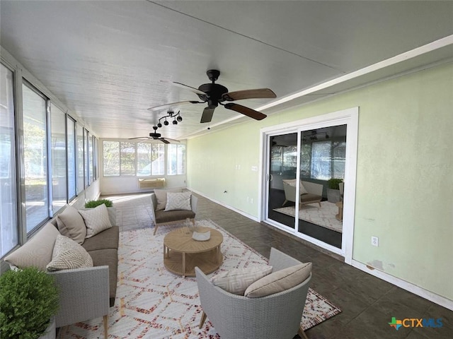 sunroom / solarium with ceiling fan