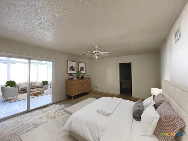 bedroom with access to exterior, ceiling fan, carpet, and a textured ceiling