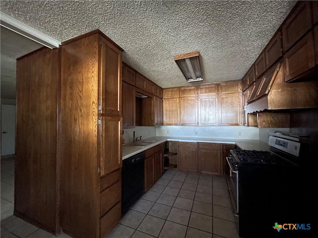 kitchen with premium range hood, black appliances, sink, a textured ceiling, and light tile patterned flooring