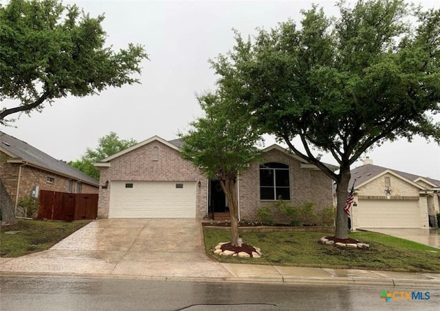 ranch-style home with a front yard and a garage