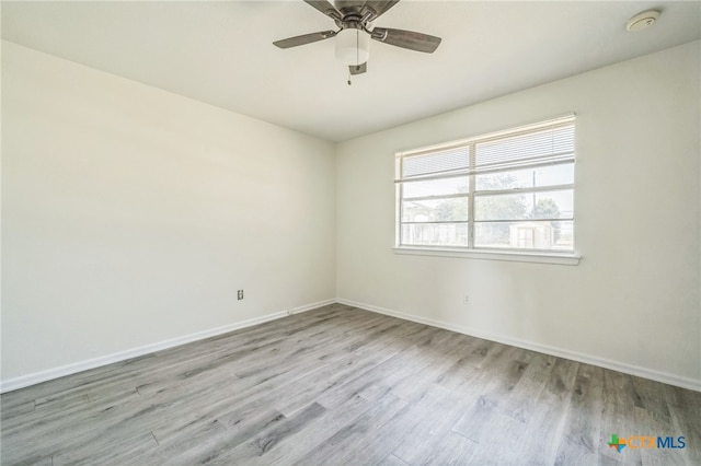 unfurnished room featuring light hardwood / wood-style floors and ceiling fan