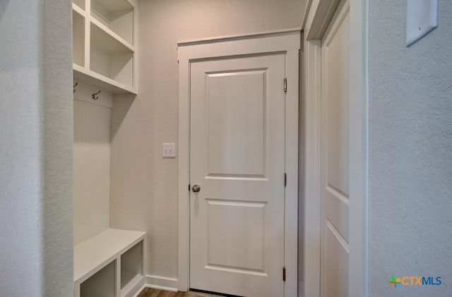 mudroom with hardwood / wood-style flooring