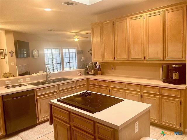 kitchen with sink, light tile patterned floors, kitchen peninsula, ceiling fan, and black appliances