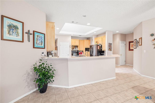 621 Brocton St, Victoria, TX 77904 - kitchen featuring stainless steel fridge with ice dispenser, light brown cabinets, light tile patterned floors, a peninsula, and black oven