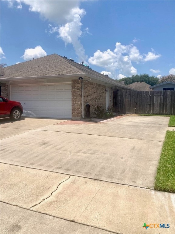 view of side of property featuring a garage