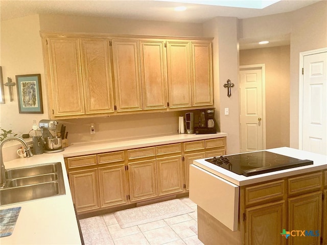 kitchen with light tile patterned flooring and sink