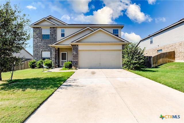 view of front of house featuring a garage and a front lawn