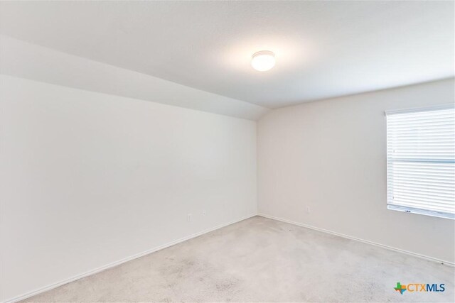3802 Endicott Dr, Killeen, TX 76549 - empty room with vaulted ceiling and light colored carpet