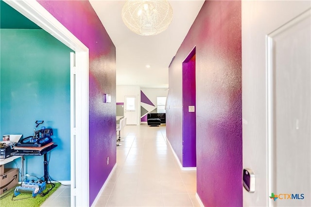 3802 Endicott Dr, Killeen, TX 76549 - corridor featuring a textured wall, tile patterned floors, and baseboards