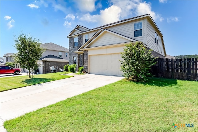 front facade with a garage and a front yard