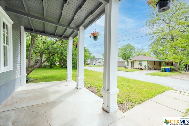 view of patio featuring a porch