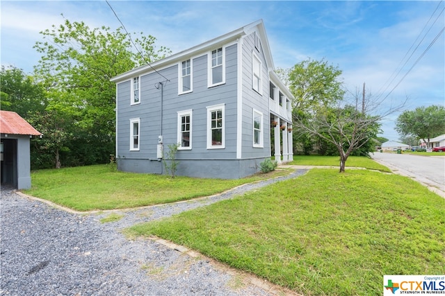 view of home's exterior featuring a yard