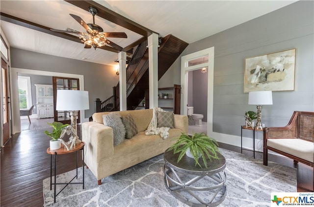 living room with ceiling fan and dark hardwood / wood-style floors