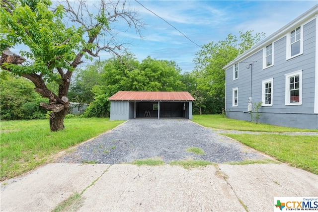 garage featuring a yard