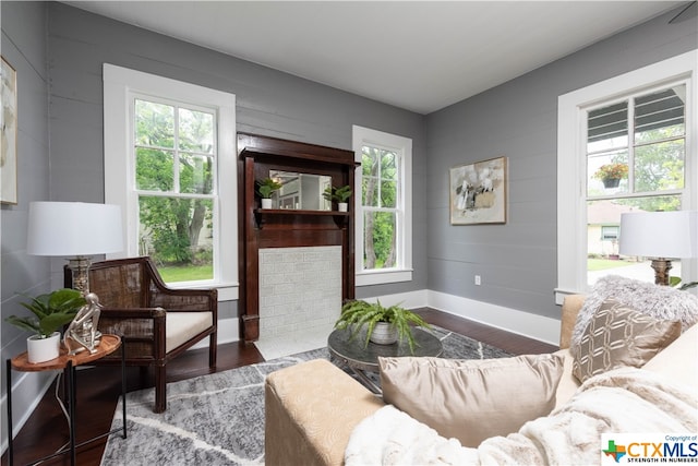 sitting room with wood-type flooring