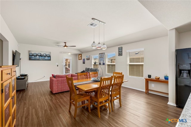 dining room featuring ceiling fan and dark hardwood / wood-style floors