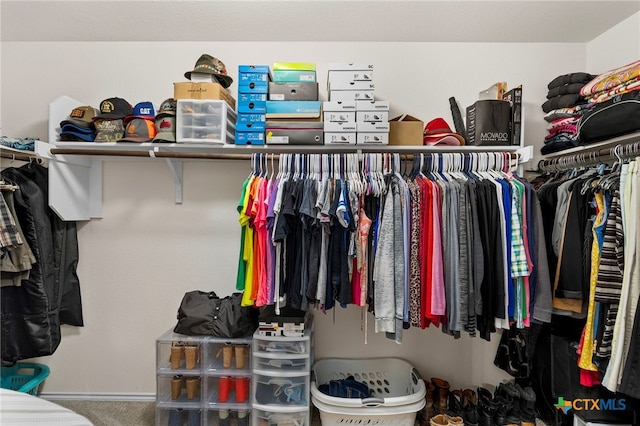 walk in closet featuring carpet